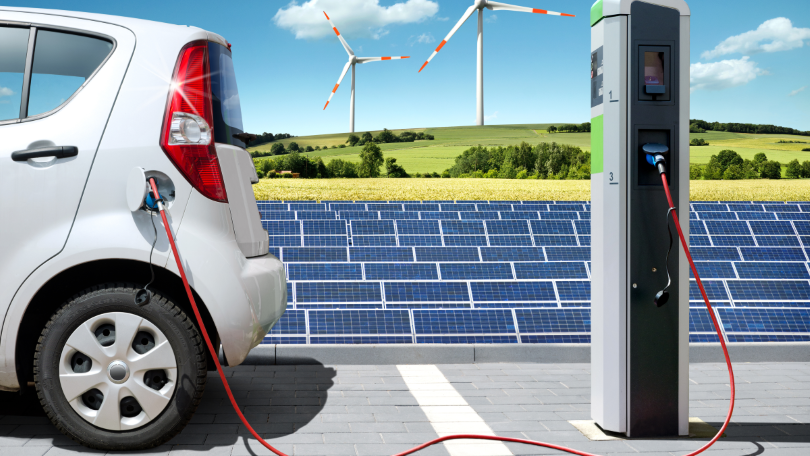 Visualisierung eines Elektroautos mit Solartankstelle und Windkraft Visualisierung eines Elektroautos mit Solartankstelle und Windkraft