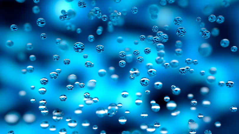Schwebende Wassertropfen vor einem blauen Hintergrund mit Helligkeitsverlauf Schwebende Wassertropfen vor einem blauen Hintergrund mit Helligkeitsverlauf