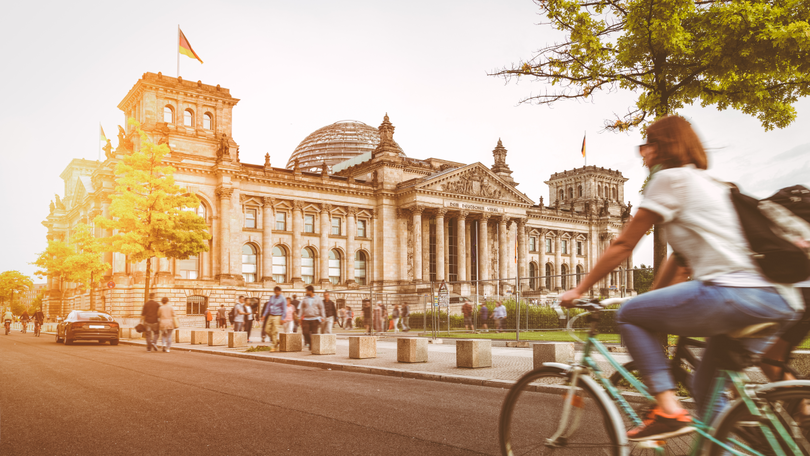 Berlin urban city life with Reichstag at sunset in summer, Germany